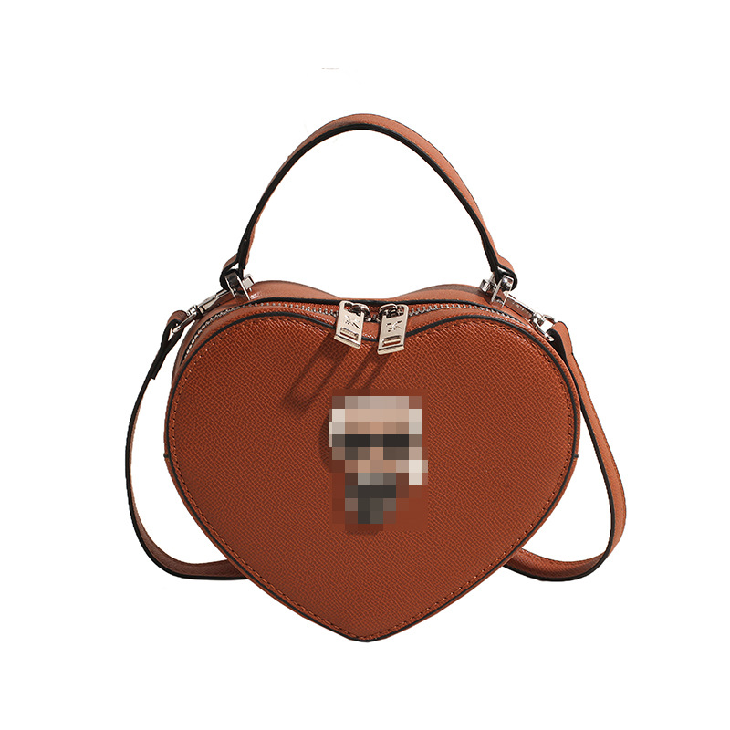 Bolsos transfronterizos para mujer 2024 nuevo bolso de hombro con diseño de corazón de nicho de moda bolso de mensajero portátil de amor de alta gama