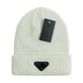 Triangular white knitted hat