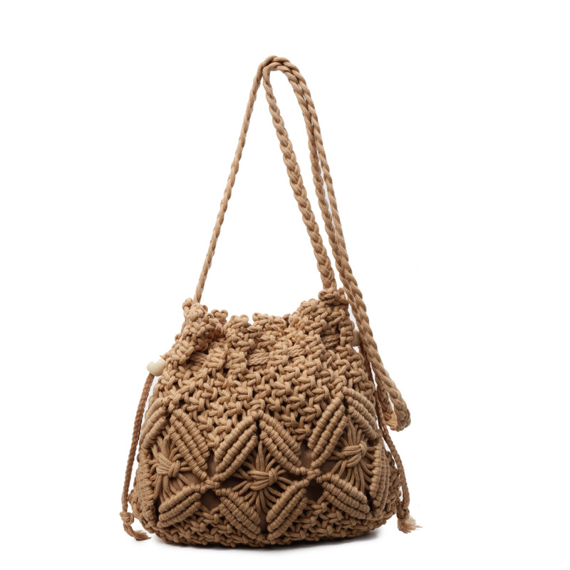Bolso de cuerda de algodón tejido para mujer verano salvaje 2025 nueva moda diseño de nicho bolso de cubo de mensajero bolso de playa hueco