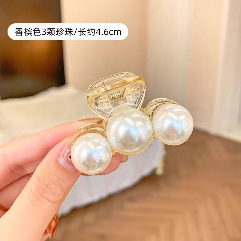 11 # Champagne-colored three-pearl hair claw clip