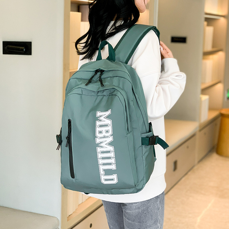 2024 nueva mochila japonesa simple de moda mochila de estudiantes de escuela secundaria gran capacidad mochila de viaje a prueba de rociadores