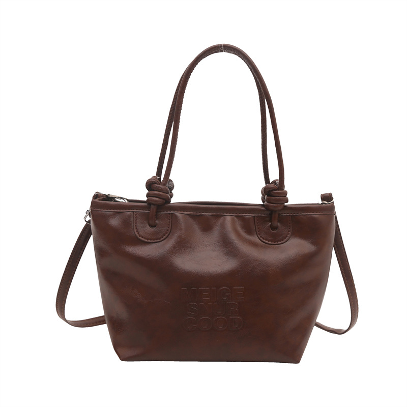 Estilo occidental retro pequeño bolso femenino 2024 nuevo otoño e invierno bolso de mensajero literario de moda bolso de cubo portátil de moda