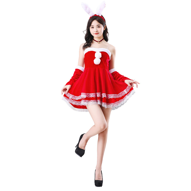 クリスマスの服の成人の女性のスーツのサンタクロースの服は服を演出します。