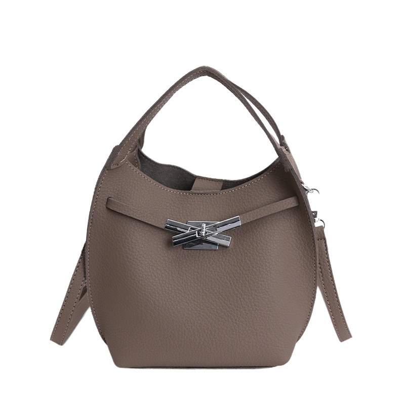 Bolso de mujer nuevo estilo coreano nicho de moda lichi bolso de cubo portátil de alta sensación de ocio mochila de viaje