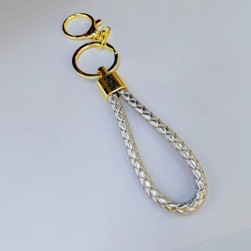 Ronda de la langosta hebilla PU cuero trenzado cuerda llavero hombres y mujeres amor llavero mano cuerda bolsa cordón fábrica directa al por mayor