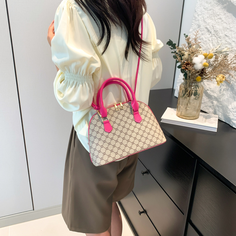 Bolso de moda simple 2024 primavera nueva bolsa de hombro de viaje de estilo extranjero bolso de mano casual bolso de concha de mujer
