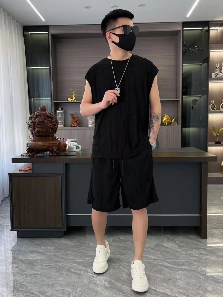 Verano nuevo estilo de hombre estilo de Hong Kong hueco agujero conjunto casual marca de moda chaleco de hombro corto conjunto de dos piezas