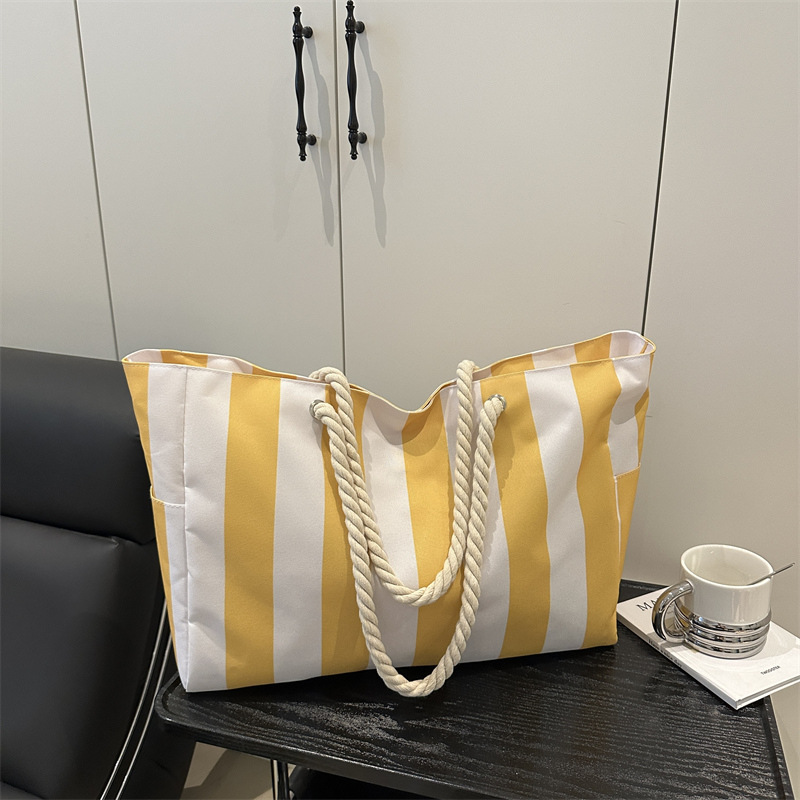 跨境尼龙包包女包2025新款简约时尚撞色大容量单肩包条纹托特包女