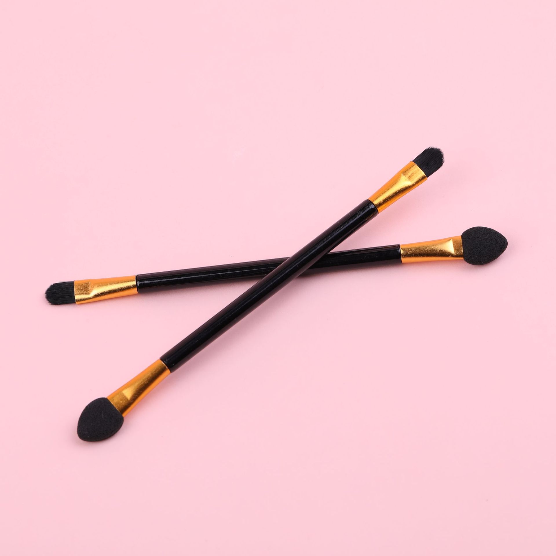 Double-sided handheld brush