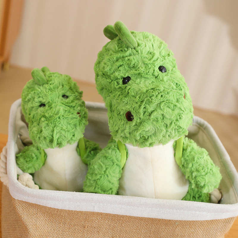 小绿龙霸王龙坐姿绿色恐龙公仔背牛油果小包儿童乐园娃娃毛绒玩具