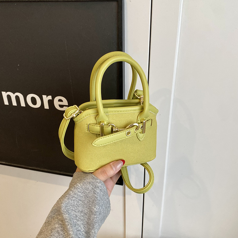 Bolsos de mano para niños lindos colgantes extranjeros mini bolsos de hombro para niños y niñas de color sólido simple bolsos de conchas de niños de moda