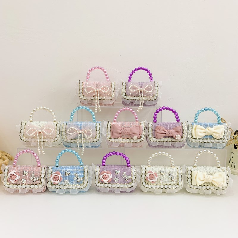 Bolsa de hombro coreana para niñas, arco de perlas, lindas flores, bolso de mochila para bebés, nuevo tipo de bolso para niños fragante.