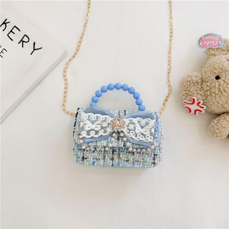 2024 nueva moda lindas bolsas de hombro para niños bolsas de perlas a cuadrícula bolsas extranjeras bolsas de hombro para niñas gran capacidad marea