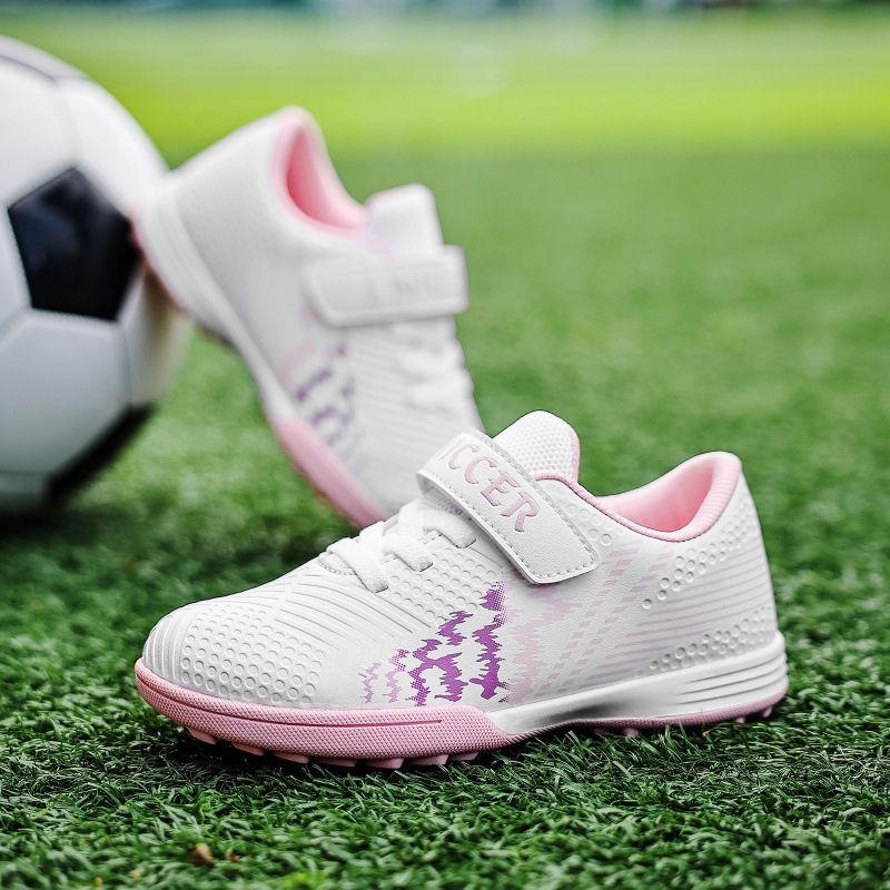 Non-slip soft-soled children's soccer shoes for school games, unisex with cleats and Velcro straps, suitable for indoor and outdoor sports training