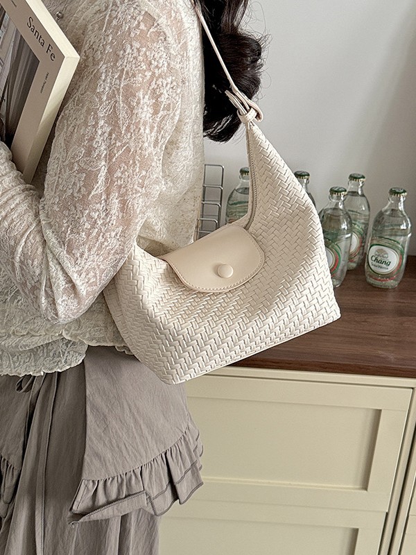 Nicho coreano tejido bolso de brazalete, bolso para mujeres 2026 nueva moda lujosa ligera, holgazante, bolso de mochila versátil
