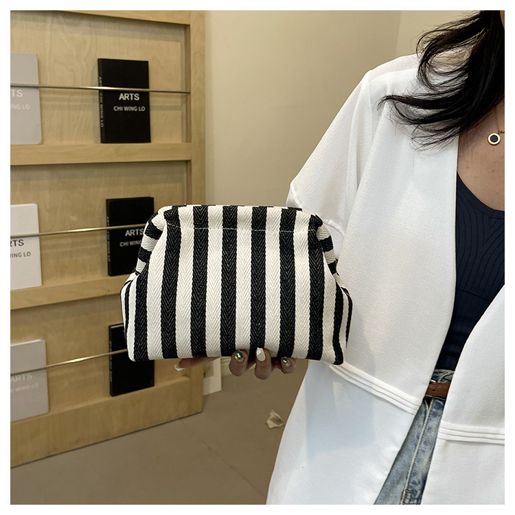 New cross-border fashion color-blocking striped cosmetic bag, women's loose change mobile phone storage bag, trendy and niche cloud clutch undefined