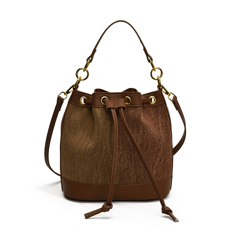 2025 otoño y invierno nuevo estilo coreano nicho bolso de cubo de agua mujer moda bolso de correa de color contraste de moda bolso de hombro