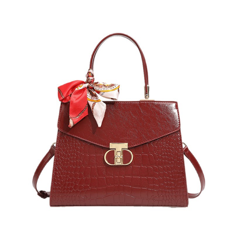 Bolso de mano con patrón de cocodrilo para mujeres 2025, nueva moda, lujo ligero, bolso de hombro universal, alta sensación de gran capacidad, mochila.