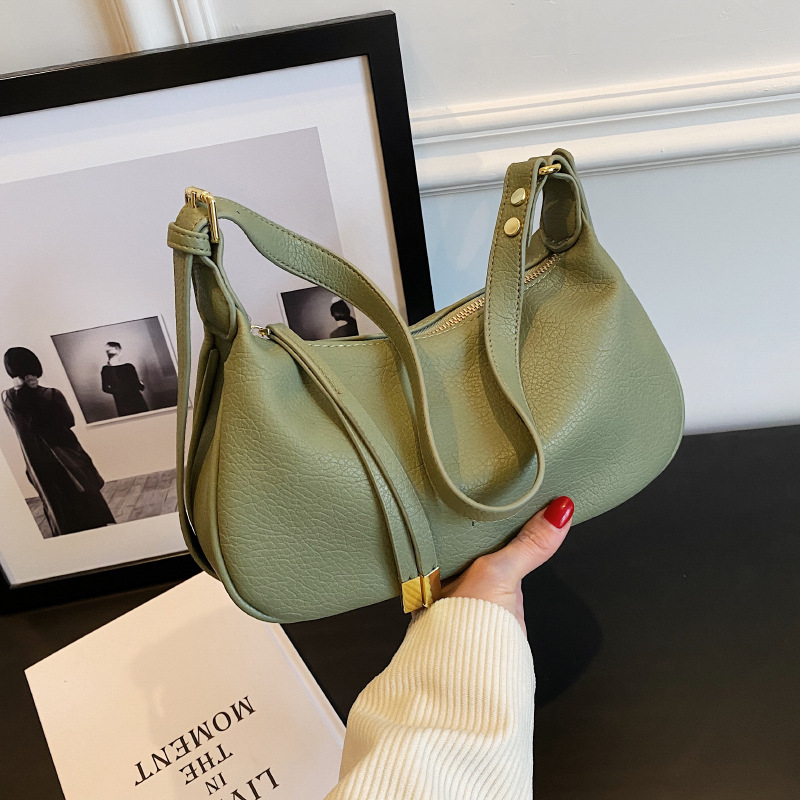 Bolso de hombro cruzado de alta calidad para mujer, nuevo estilo, con patrón de lichi, bolso de moda de nicho, tipo dumpling.
