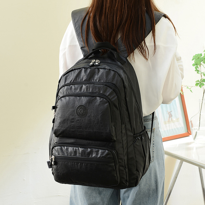 Nueva Mochila De tela impermeable pequeño mono colgante multi-compartimiento Mochila GRANDE mochila de viaje para estudiantes masculinos y femeninos