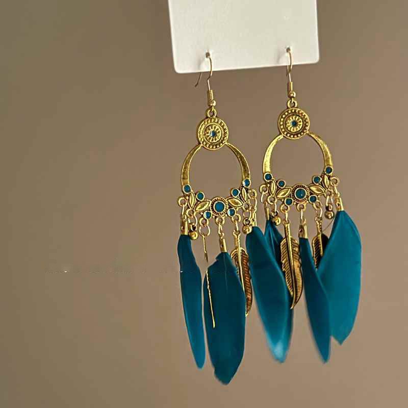 Pendientes de borla de cuentas de arroz con plumas de gota de agua bohemia Pendientes de estilo de vacaciones retro de nicho Pendientes de estilo étnico de lujo ligero