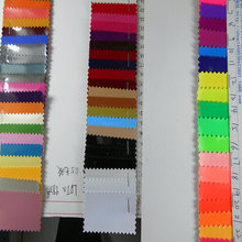 珠光0.5/0.6镜面PU荧光革PVC亮光亮面平纹光胶布底人造革箱包面料