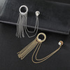 Golden brooch with tassels, trend silver suit, chain, pin