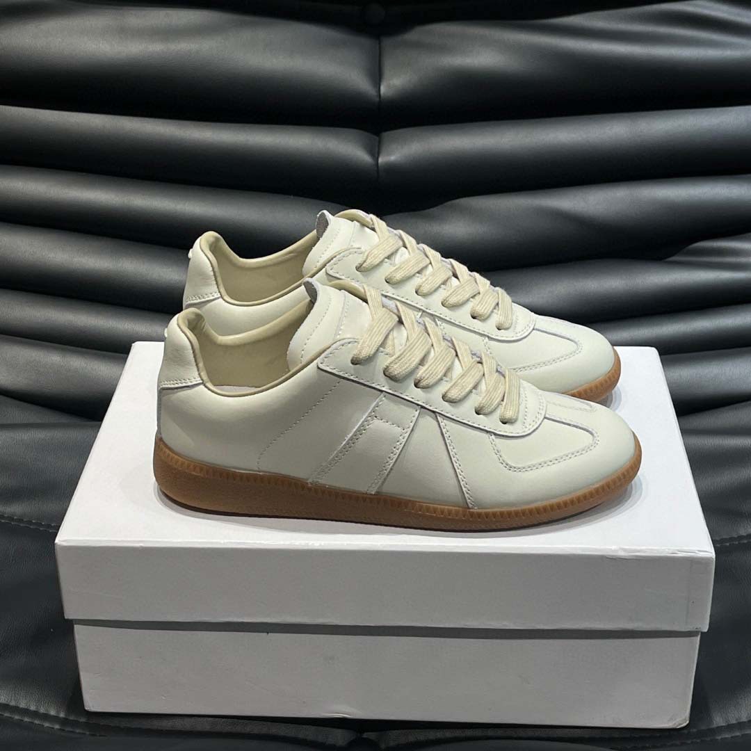 Estación europea 2025 nuevos zapatos de entrenamiento alemanes para hombres y mujeres zapatos planos casuales de todo fósforo zapatos de pareja con cordones de cuero zapatillas de deporte