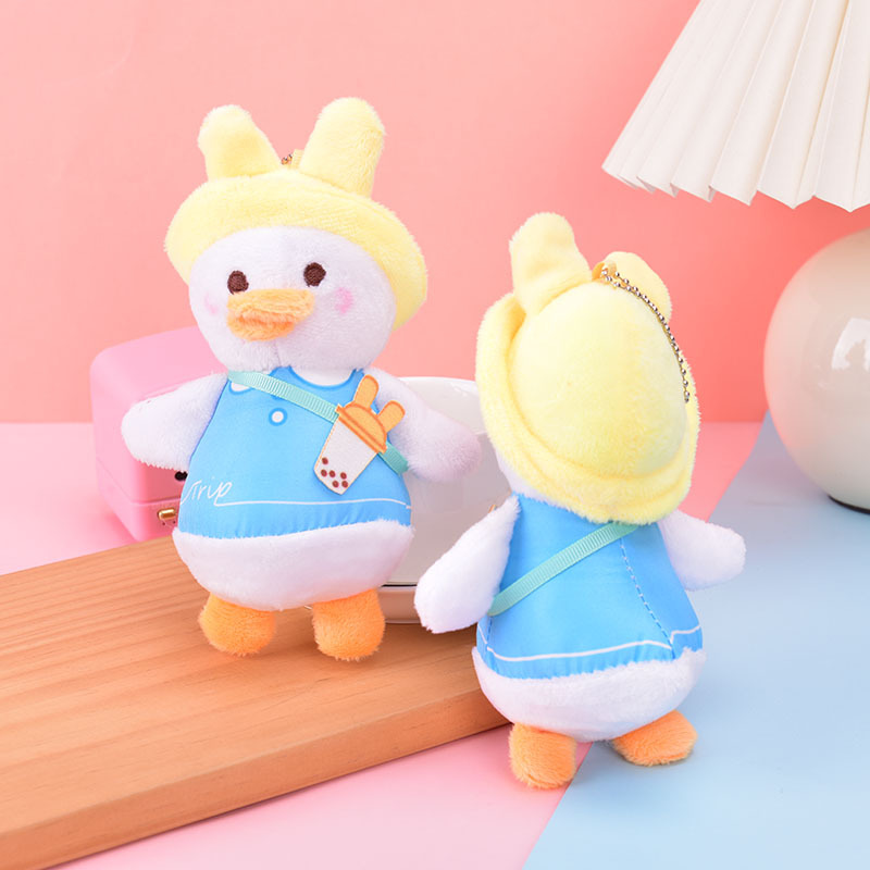 新しいかわいい日系スタイルのミルクティーのアヒルのぬいぐるみの小学生のリュックサックのキーホルダーのペンダントのプレゼント