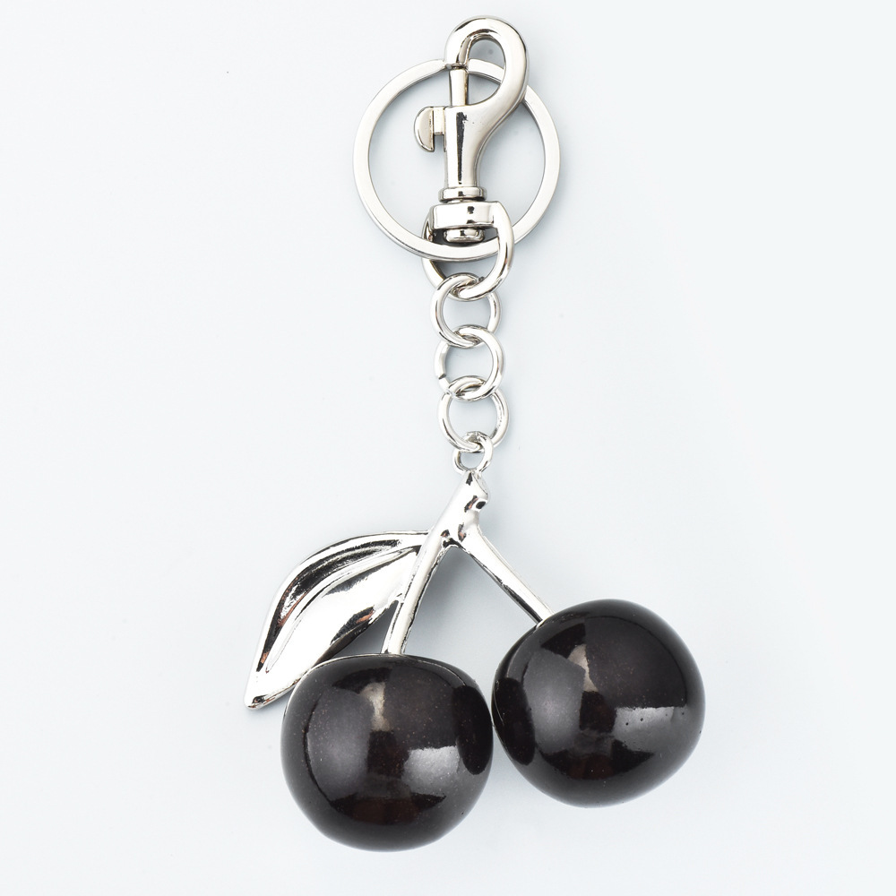 Transfronterizos venta caliente de cereza bolsos colgantes bolsos de mujer joyas hermosas llaveras de automóviles elegante hebilla de pareja