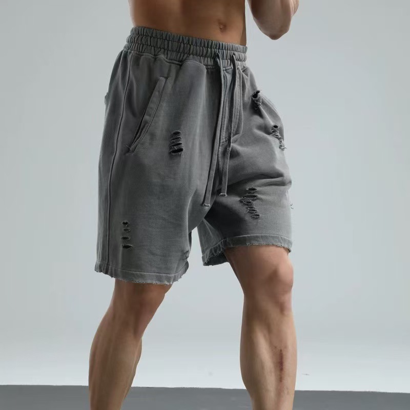 380G marca de marea transfronteriza lavada con agua para hacer viejos pantalones de protección agujeros múltiples pantalones retro de cinco puntos deportivos casuales pantalones de estilo de vestir