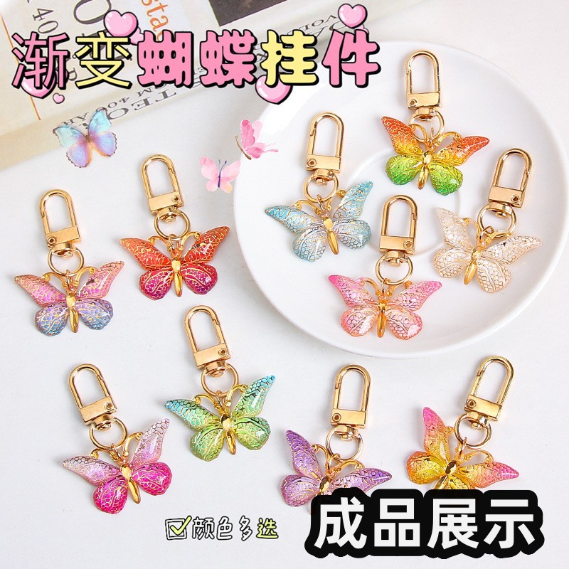 Colgante de mariposa transfronteriza de color creativo de personalidad acrílico europeo y americano bolsas de auriculares bolsas de decoración accesorios