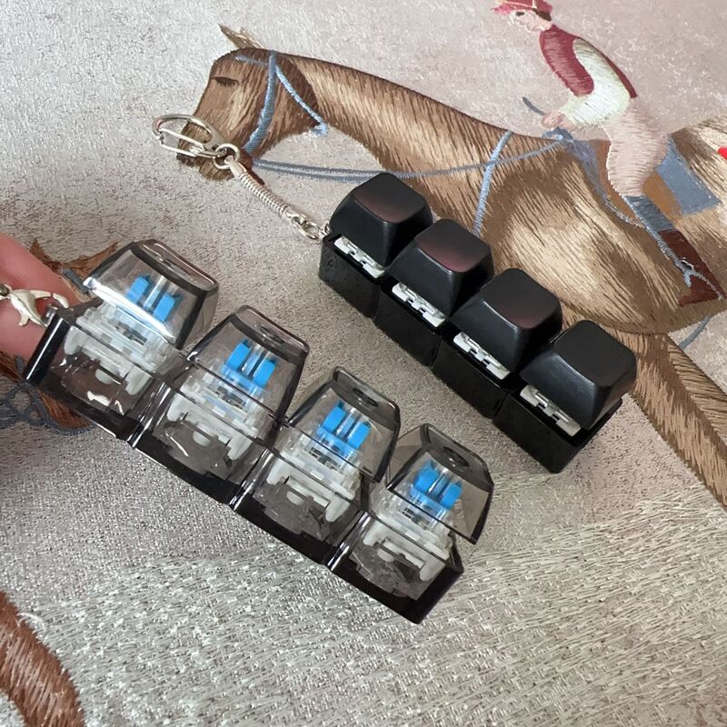 Cross-border 4-key decompression key axle tester key chain pendant fingertip pressure decompression luminous toy fingertip button