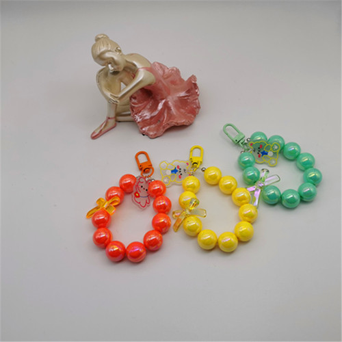 Electroplated beaded bow car keychain mobile phone pendant cute candy color paint circle pearl accessories bag decoration