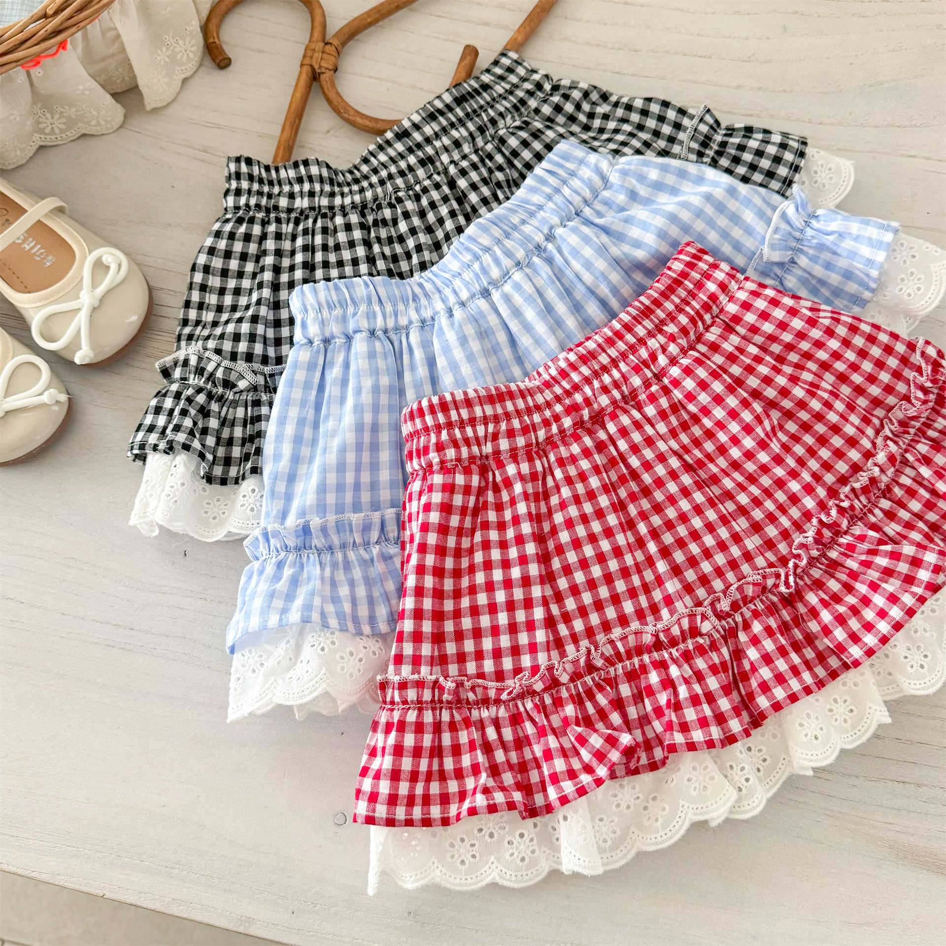 Xianning siete ropa para niños falda corta para niñas 25 verano nuevo estilo estilo occidental bebé falda de pastel a cuadros única y hermosa