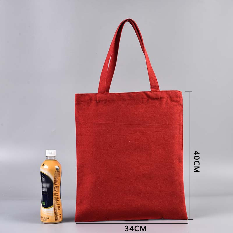 En stock bolsa de lona portátil en blanco personalizable logotipo de impresión en color de un solo hombro bolsa de compras bolsa de algodón de entrenamiento publicitario