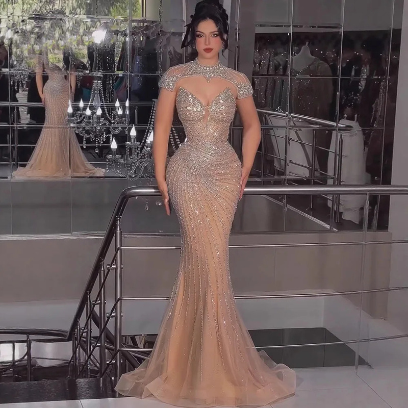 Luxurious Nude-Colored Evening Gown with Heavy Beading, High Collar, Detachable Cape, and Fishtail Design for Women La73087 Luxurious Nude-Colored Evening Gown with Heavy Beading, High Collar, Detachable Cape, and Fishtail Design for Women La73087