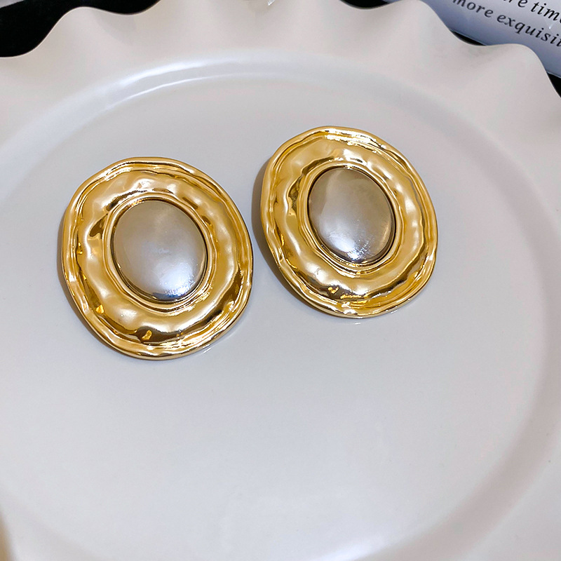 Pendientes elípticos exagerados transfronterizos de metal con aguja de plata Pendientes de moda de nicho europeo y americano Pendientes de lujo ligero simples y de alta gama mujeres