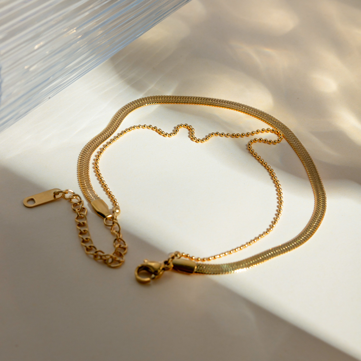 Europa y los Estados Unidos transfronterizos INS viento femenino 18 quilates oro pulido cuchilla cadena cadena de serpiente cadena de perlas Xiaomi doble tobilla joyería al por mayor