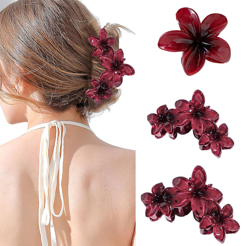 Elegant hårklämma med bordeauxfärgad plumeriablomma_voghion.com