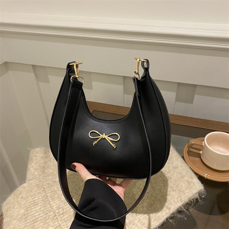 Sensación de la axila bolso pequeño mujer 2025 primavera nueva moda todo-fósforo bolso de hombro diseño de nicho bolso de palo francés mujer
