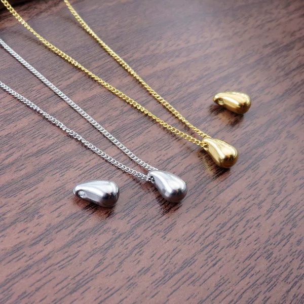 Stainless steel pierced water drop pendant, oil-drop bead design, simple necklace for women, 18K gold pendant, sweater chain with matching chain