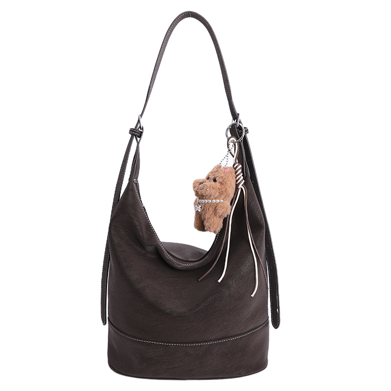 2025 nuevo tipo de bolso coreano bolso de transporte de mujer gran capacidad bolso de cubo de agua viento lento viaje de hombro bolso de brazo