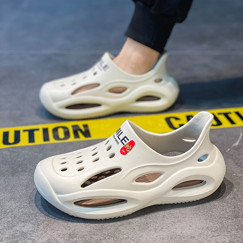 Pareja casual zapatos de playa nuevos hombres y mujeres de suela gruesa zapatillas Baotou sandalias de suela blanda zapatillas de verano zapatos con agujeros para el cabello