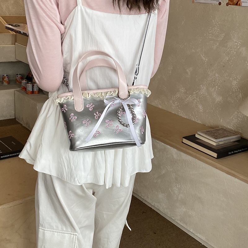 Hermoso arco bordado bolso de cubo de agua dulce encaje bolso de mano de niña nueva bolsa de niños transfronteriza