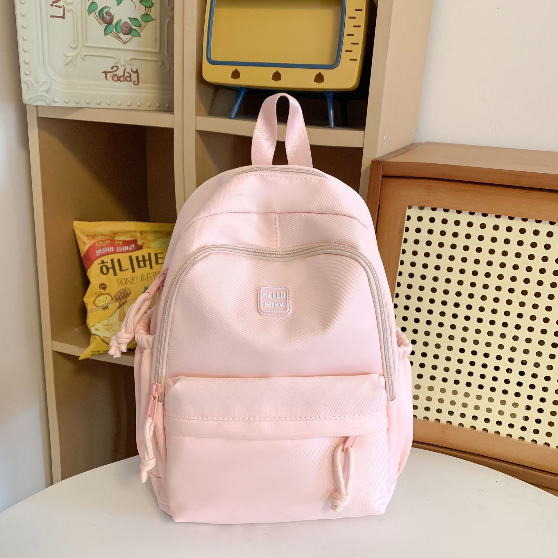 La nueva mochila simple y versátil de gran capacidad Mori es una mochila de estilo universitario pequeña y fresca, bolsa de computadora de viaje