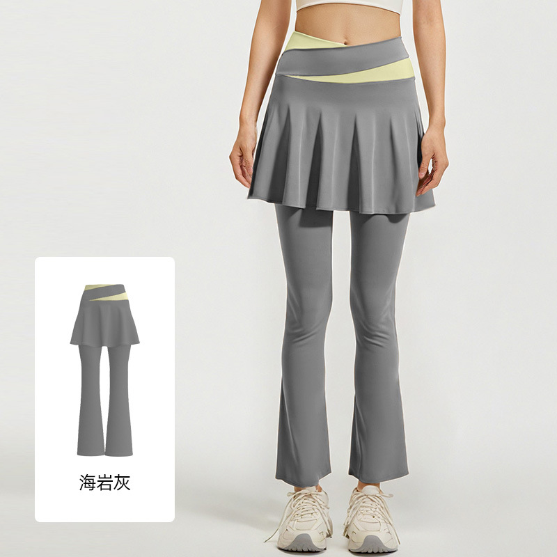 Los nuevos pantalones de falda de cuerno a juego de color de Juyitang son elásticos y delgados, falsos dos pantalones de yoga para correr de cintura alta