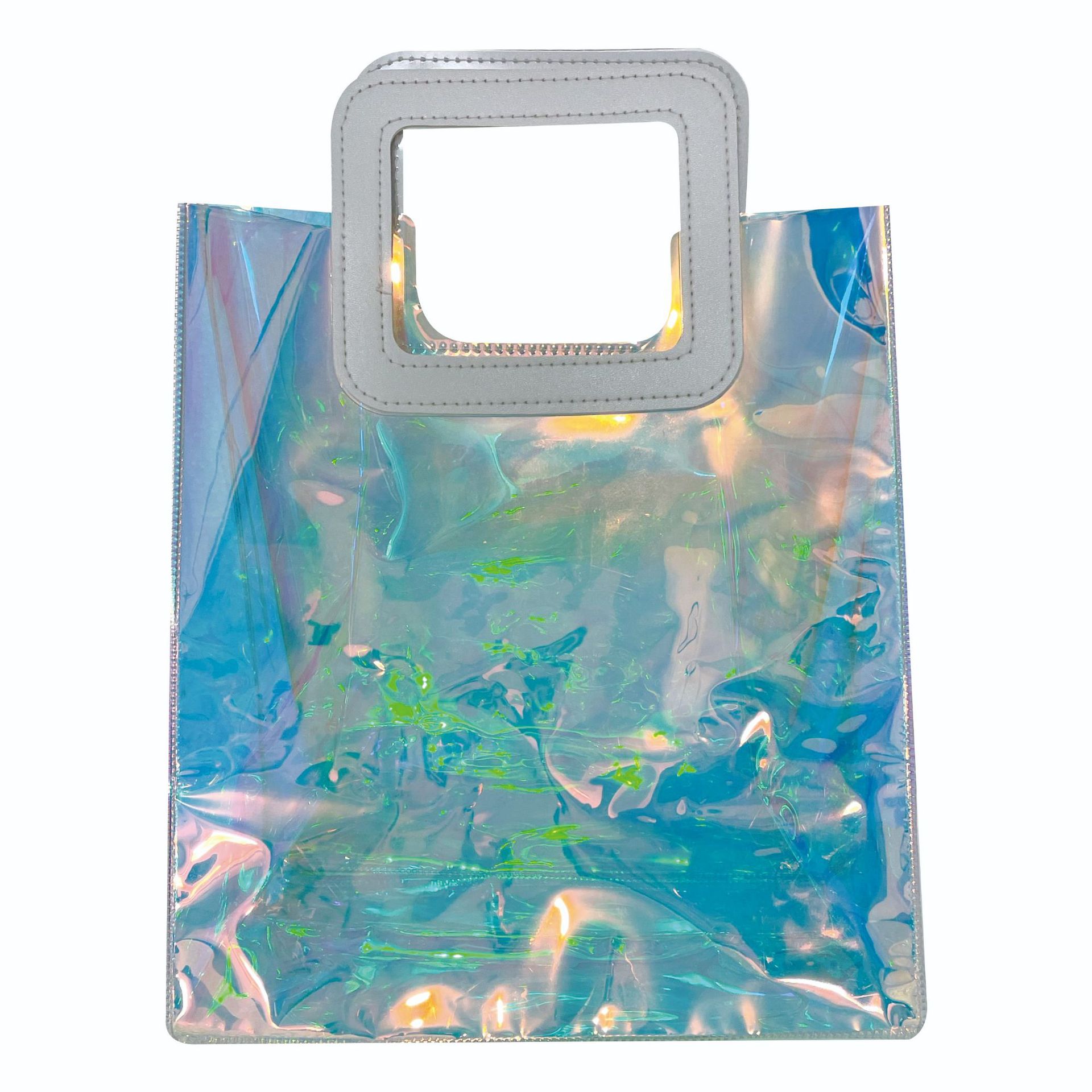 Bolsa de mano transparente de PVC, bolsa de regalo de plástico, bolso de mano láser, bolsa de regalo transparente en stock, proceso láser