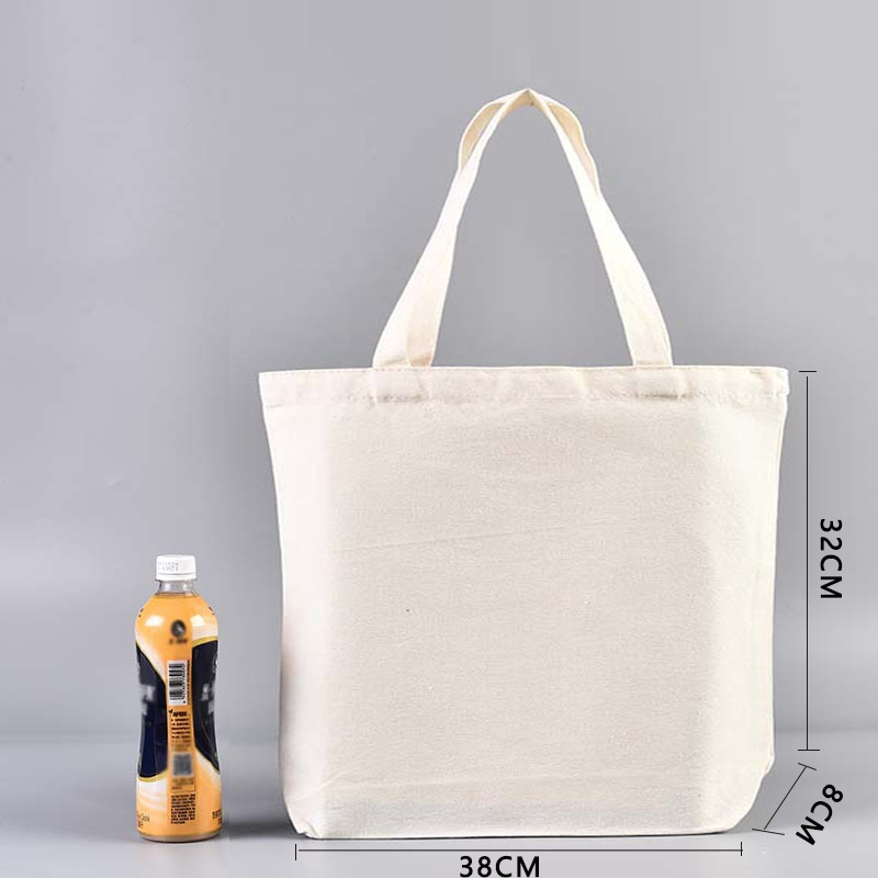 En stock bolsa de lona portátil en blanco personalizable logotipo de impresión en color de un solo hombro bolsa de compras bolsa de algodón de entrenamiento publicitario