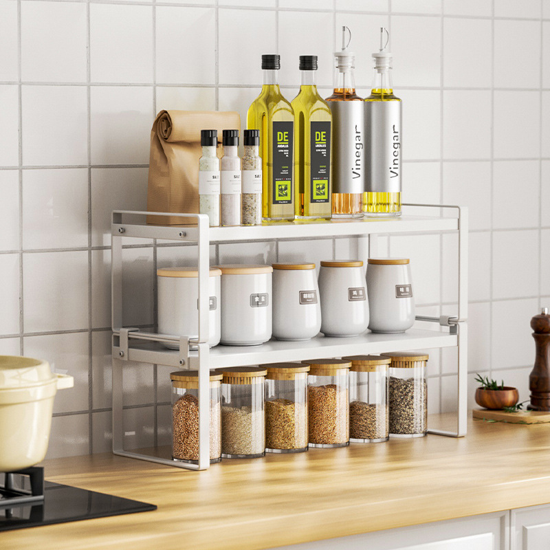 Kitchen counter with layered shelves, white desktop storage rack, storage divider, seasoning bowl and plate, cooking pot